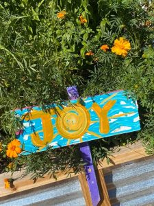 JOY sign in a garden