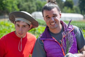 Common Roots Farm CA 2 men gardening and smiling