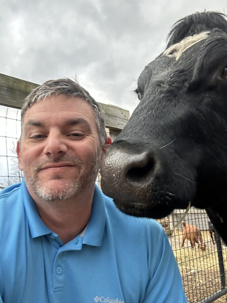 Brian with a cow