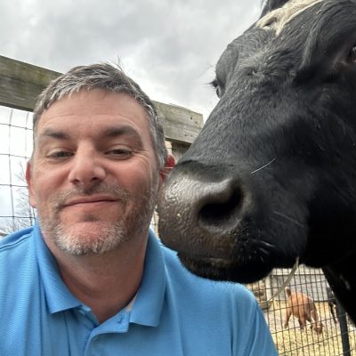 Brian with a cow