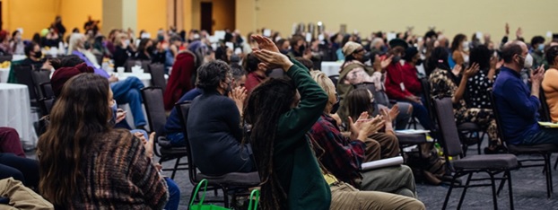 Group of people at Pasa Conferenced sitting in conference chairs