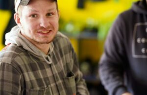SMB Arbor Farm Rural Day Program Man in hat smiling at camera